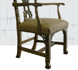 Carved-arm Chippendale corner chair restored in cream upholstery