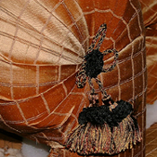 Curved-back sofa in patterned brocade